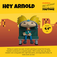Youtooz Arnold vinyl figure with blue cap and yellow hair enhances shelf presence.