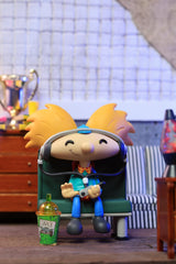 Youtooz Arnold vinyl figure with yellow hair evokes retro style for collectibles display.