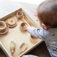 Yowlieu pouring and transferring activity supports fine motor practice.