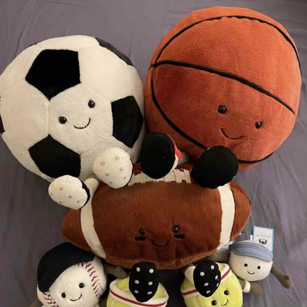 Decor setup featuring the YUDONG football plush pillow as a bright room accent.