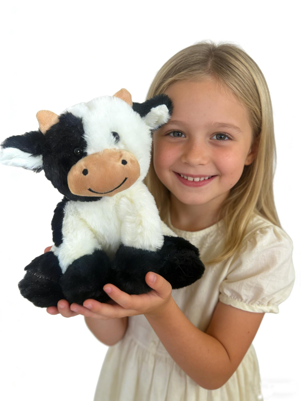 YUKOUQIAN cow plush in a child's arms for playtime