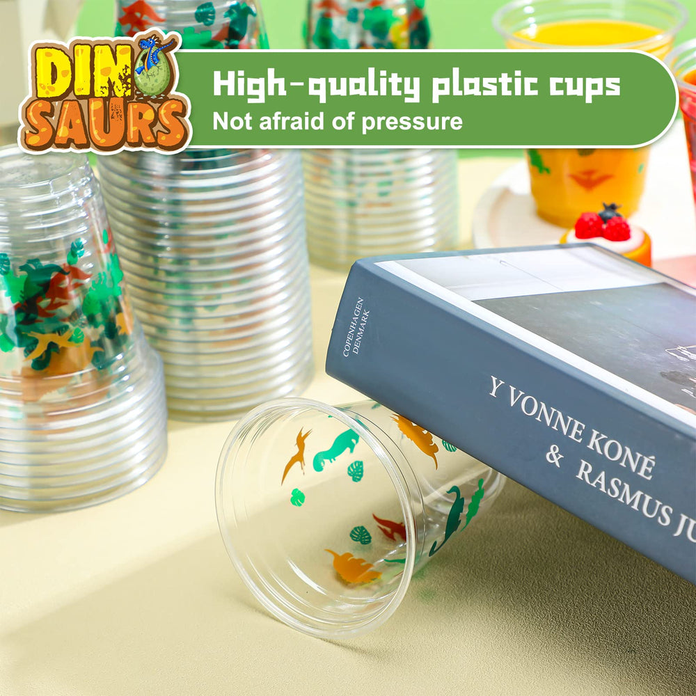 Yuxung dinosaur cups printed leaves create a cohesive dinosaur-themed party presentation.