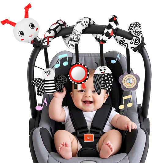 Zendstanding spiral pendants on car seat toy demonstrating visual focus for newborns