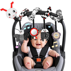 Zendstanding spiral pendants on car seat toy demonstrating visual focus for newborns