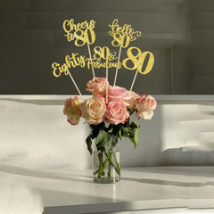 ZHUOWEISM Glitter card stock sticks shine under lights, drawing attention to cake and flowers.