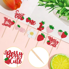 ZHUOWEISM Glitter strawberry toppers stand out on first birthday desserts under party lights.