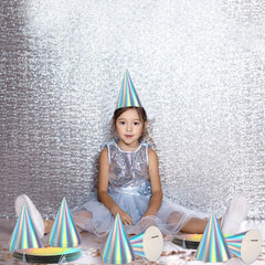 ZOIIWA iridescent hats decorating holiday celebrations and themed gatherings.