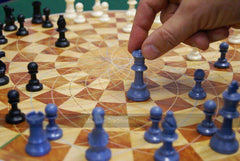 3 Man Chess retail packaging includes board, pieces, rule sheet