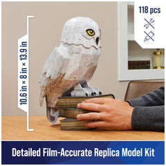 4D Build Hedwig perched on stack of books as a movie-inspired centerpiece.