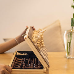 A&amp;A travel-ready chess set fits compactly in a pine box.