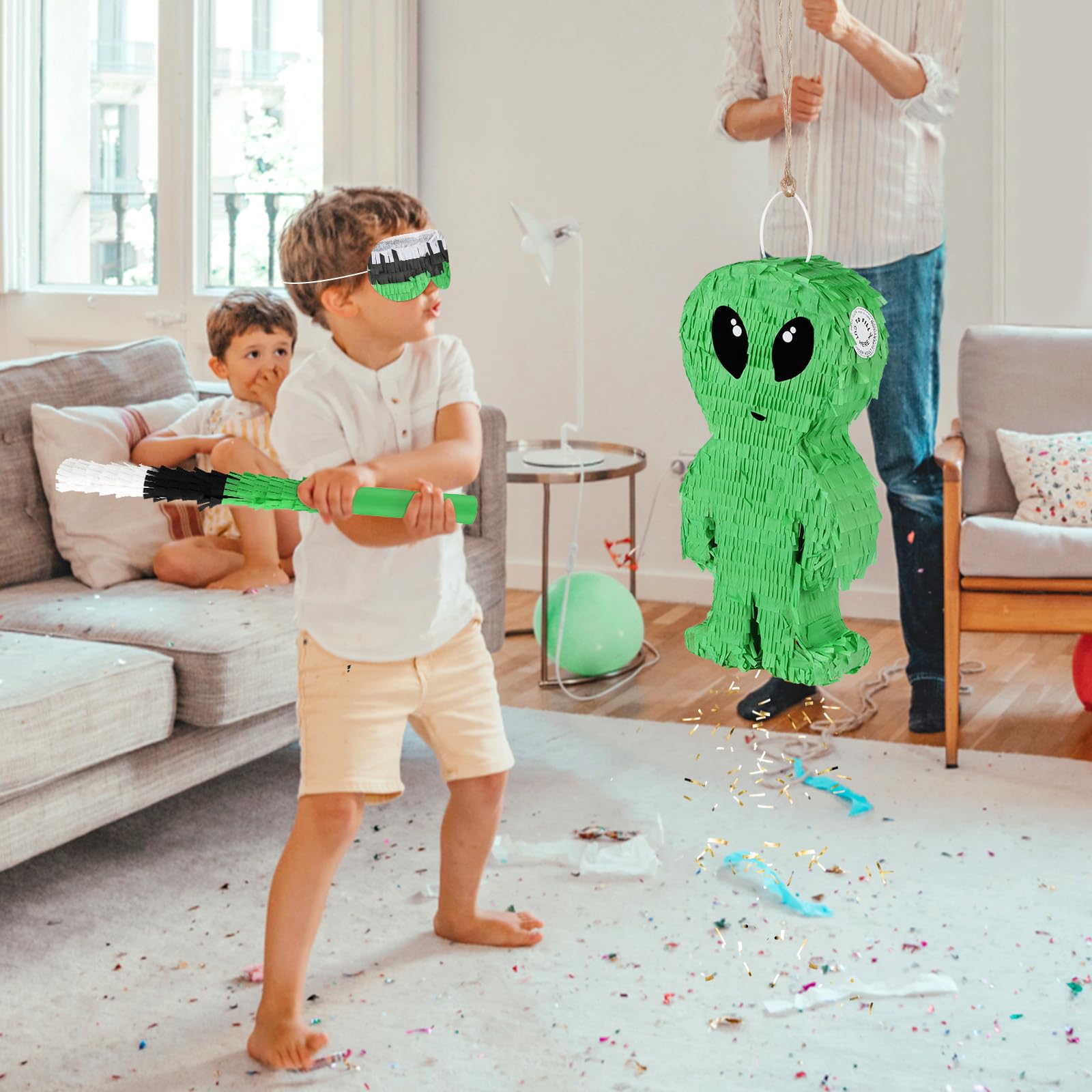Space-themed pinata setup with alien decoration