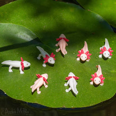 Accoutrements Itty Bitty Axolotls shelf display, whimsical collection