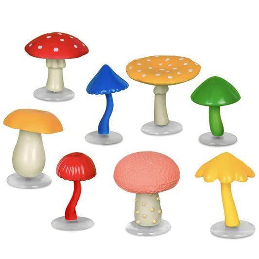 Accoutrements Mcphee soft vinyl mushrooms with stand brighten a desk or shelf.