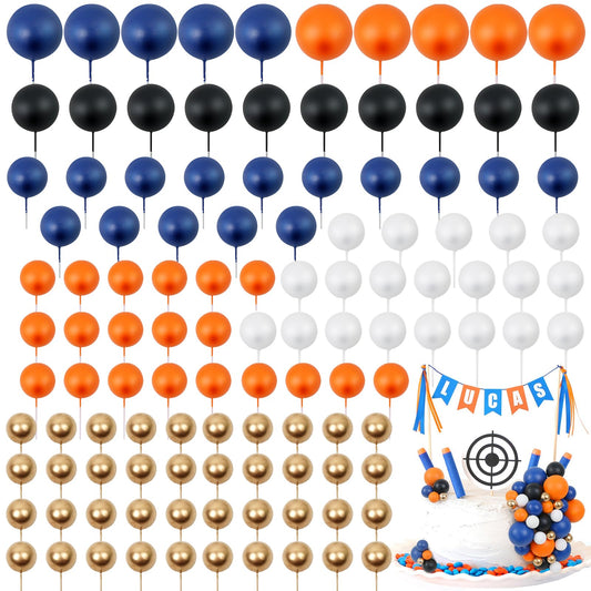 Acmee ball cake toppers in navy, orange, white, and gold elevate celebration cakes