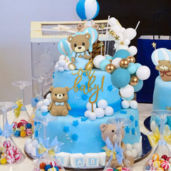 Acmee 'oh baby' topper with cloud accents for whimsy.