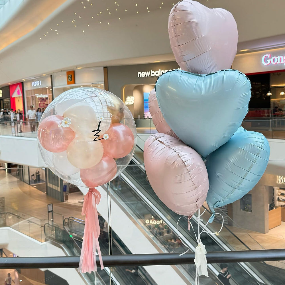 Adorely blue heart foil balloon arrangement creates soft color for birthday events