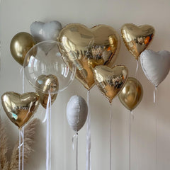 Adorely 18-inch heart foil balloons create elegant baby shower accents.