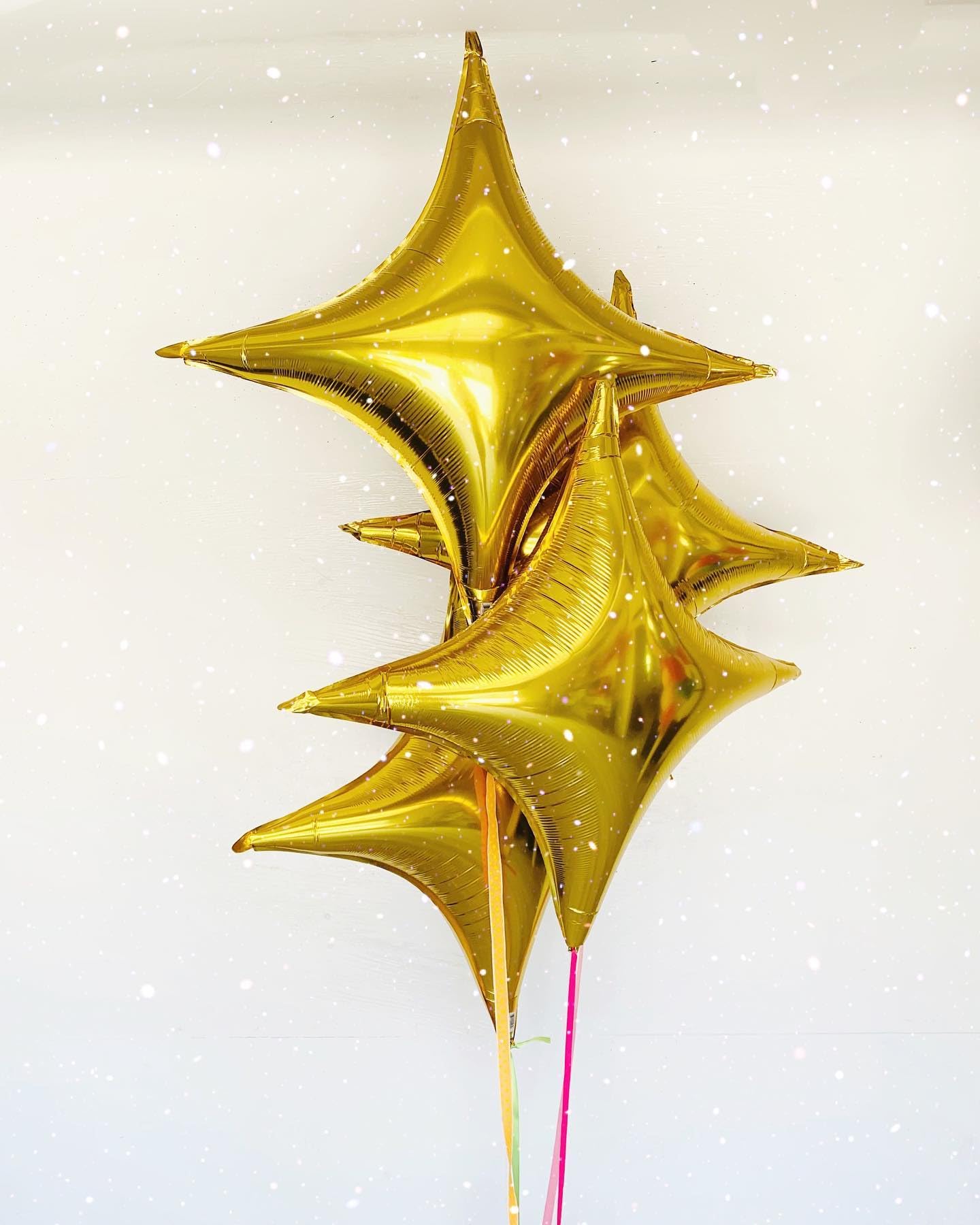 Adorely Gold Star Balloons arranged in a party bouquet for festive ambience.