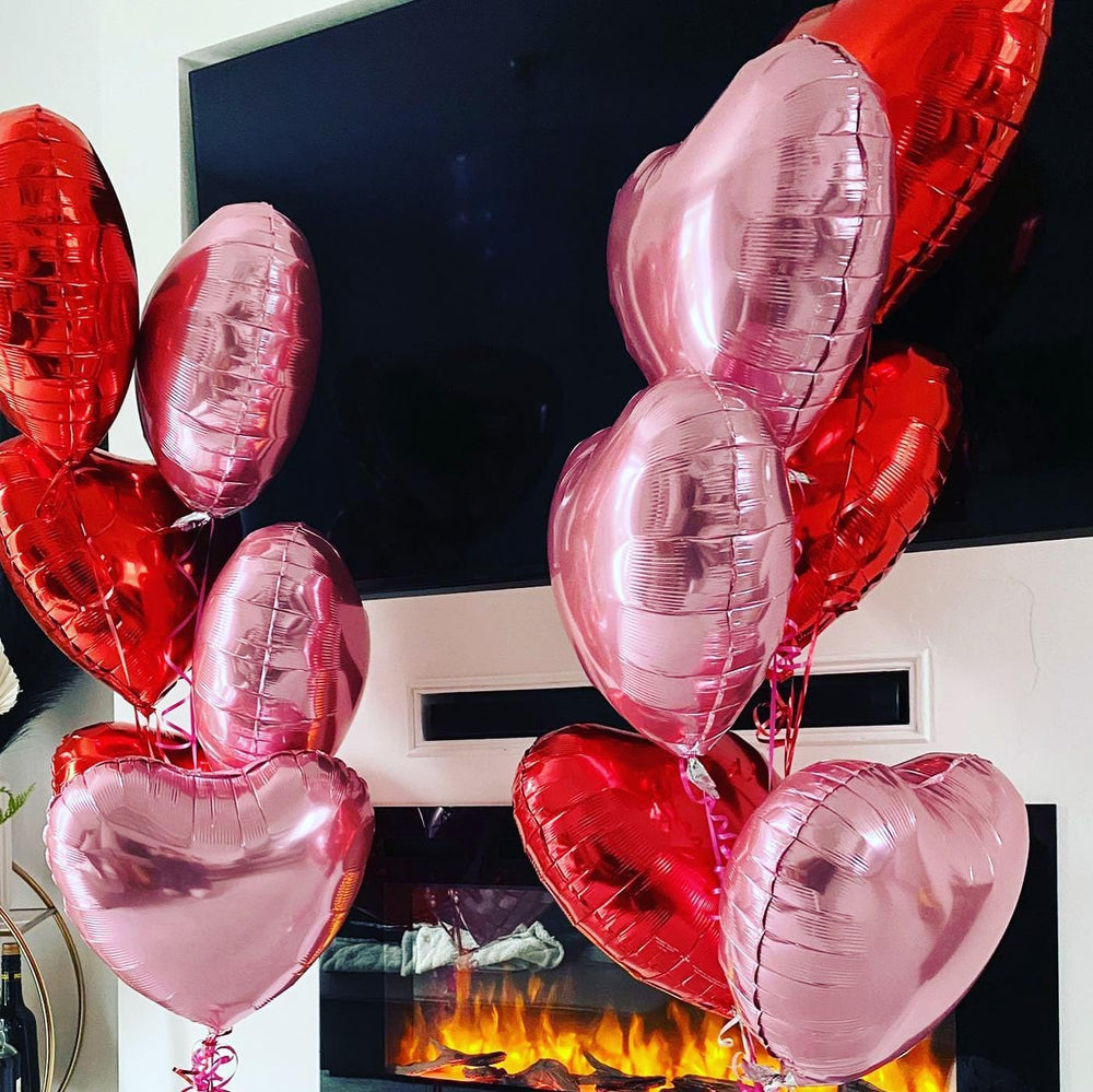 Adorely pink heart balloons create a romantic backdrop for photos