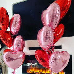 Adorely pink heart balloons create a romantic backdrop for photos
