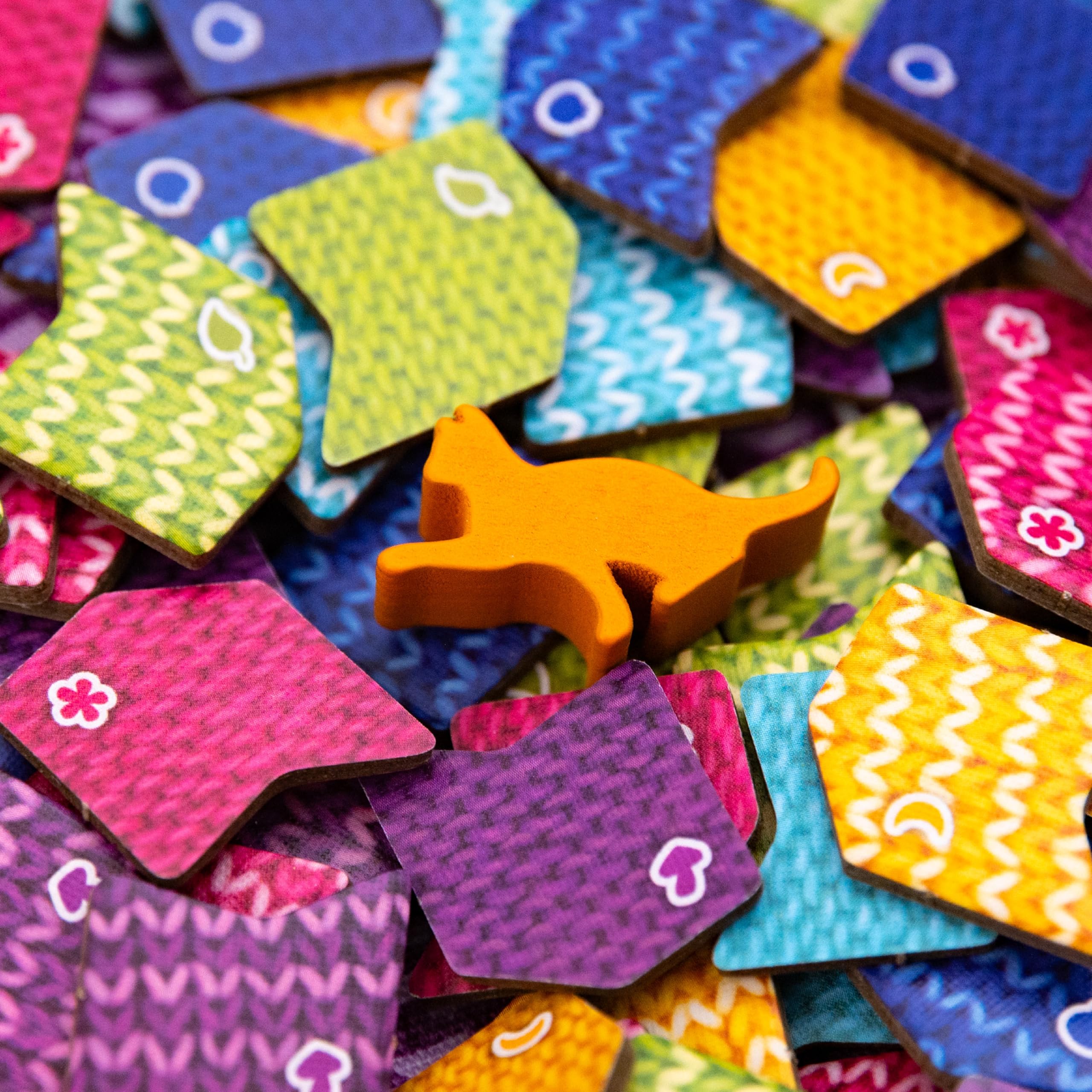 AEG Knitting Circle player mats help organize turns.