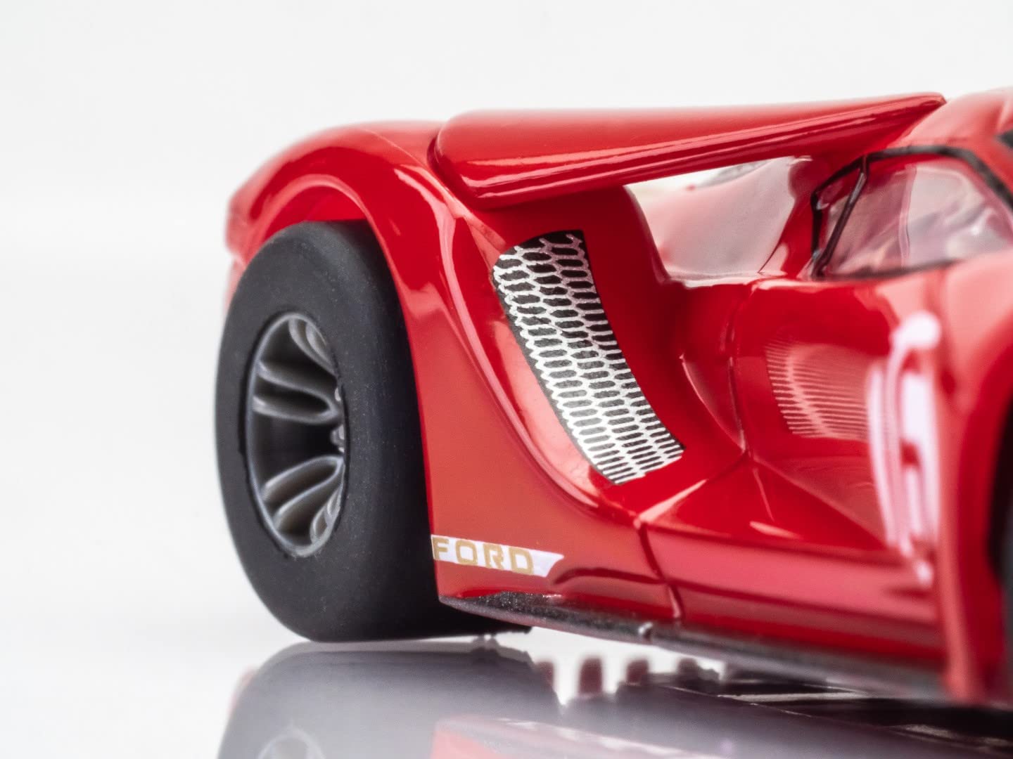 AFX Ford GT Heritage #16 gold racing stripes accent premium aesthetics