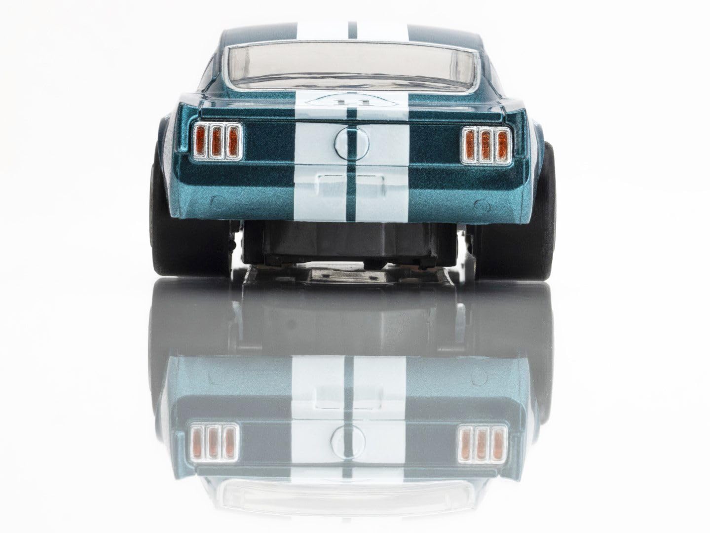 AFX Shelby GT350R 1965 Donohue track-action shot illustrates fast-paced racing potential.
