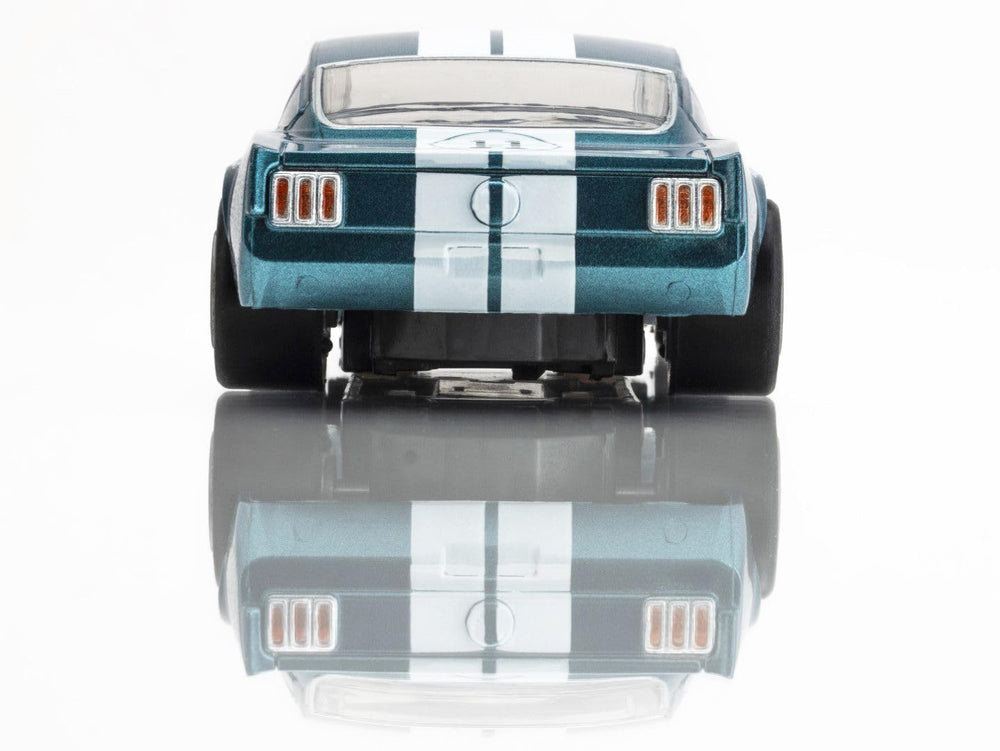 AFX Shelby GT350R 1965 Donohue track-action shot illustrates fast-paced racing potential.
