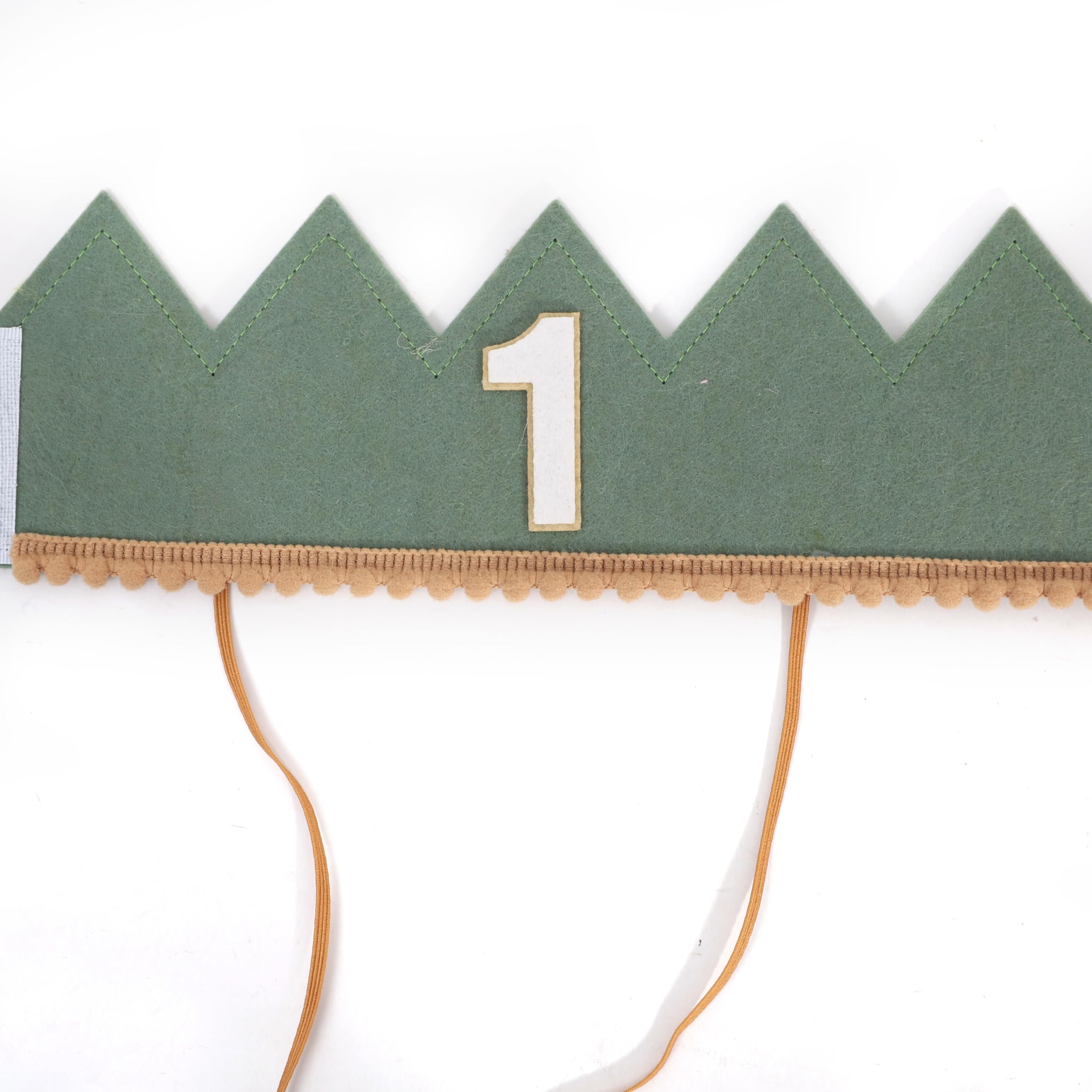 Number 1 accent on the crown emphasizes the milestone.