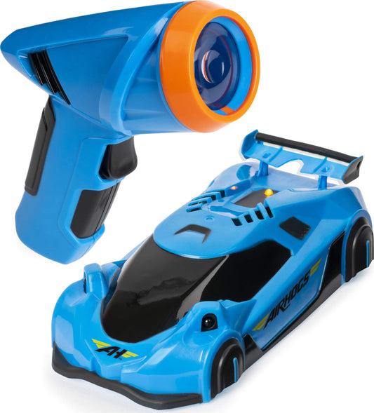 Air Hogs Zero Gravity Light Wall Racer gliding on a smooth wall with blue glow.