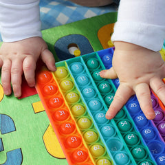 AK-SHIP rainbow design invites playful math practice and social interaction.
