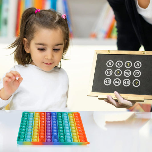 AK-SHIP 100-bubbles math toy showing number grid aids visual learning.