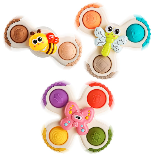 ALASOU pop suction cup spinner on fridge promotes grip strength and hand-eye coordination.