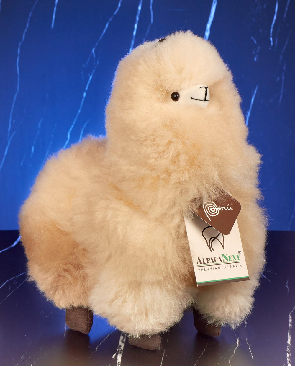 AlpacaNext beige plush alpaca close-up showing soft fur for cuddle comfort