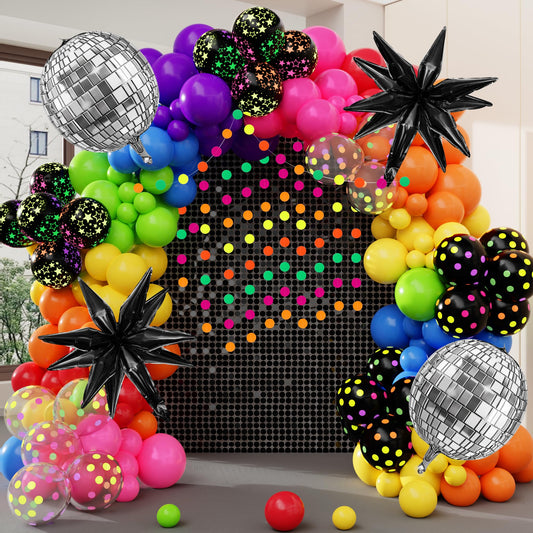 Amandir glow-in-the-dark arch balloons create a vibrant UV-lit party backdrop.