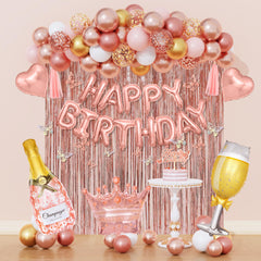 Amandir rose gold balloons create a chic birthday backdrop for photos
