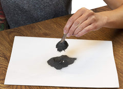 American Heritage iron filings pouring image emphasizes easy handling in class.
