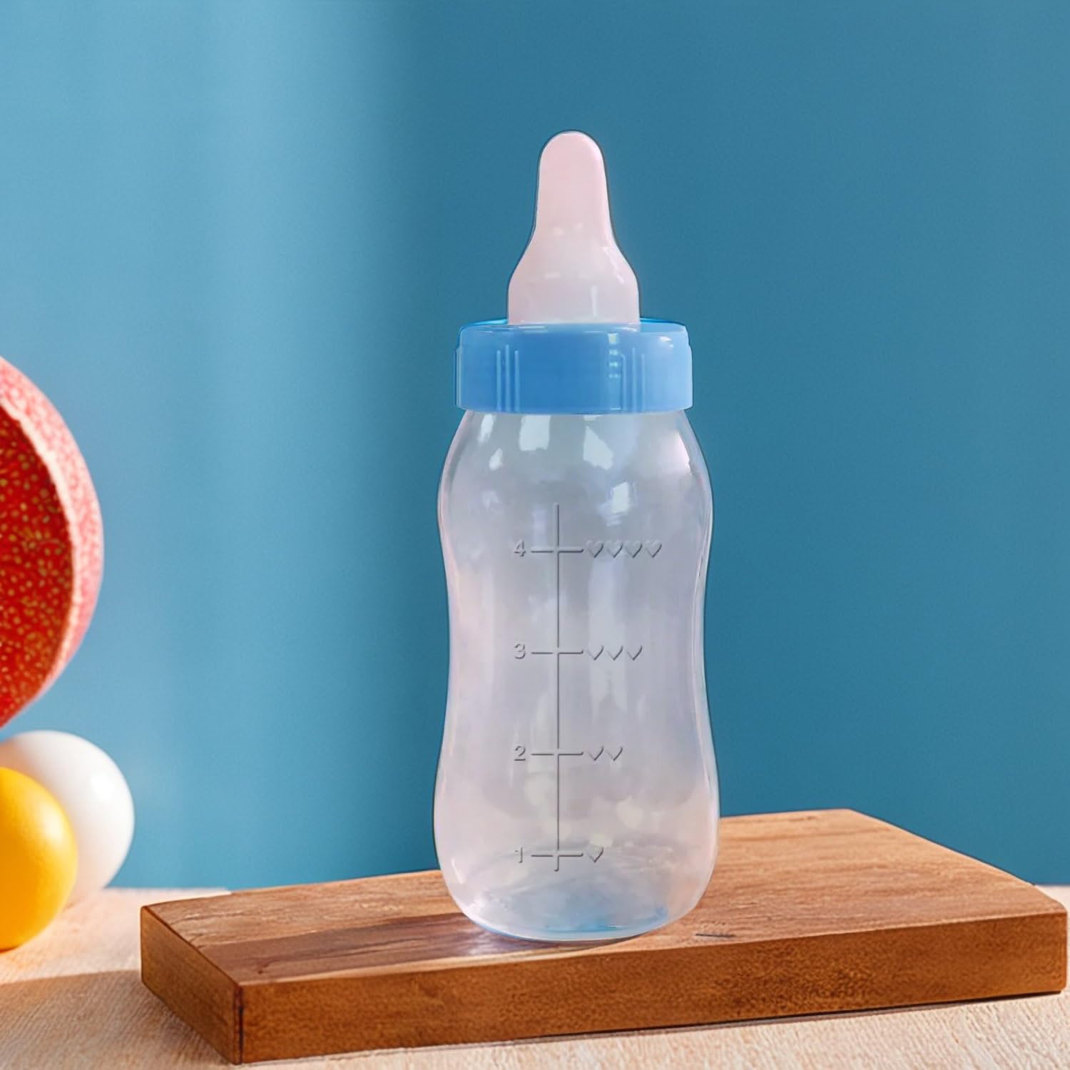 Amscan Blue Baby Bottle Bank serves as a centerpieces and keepsake for celebrations.