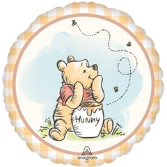 Anagram Pooh Honey Jug 17-inch foil balloon adds playful accents.