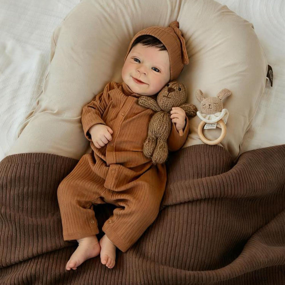 Anano Realistic Reborn Baby Doll wearing included clothes for dress-up play.