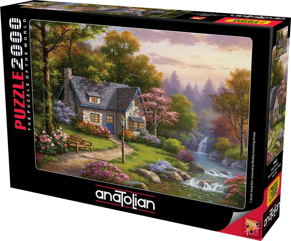 Anatolian Stonybrook Falls Cottage puzzle on an assembly desk for family night