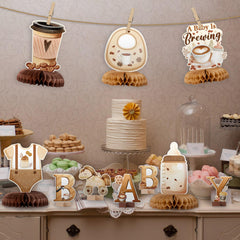 ANGOLIO coffee-themed centerpiece complements gender reveal and pregnancy announcements.