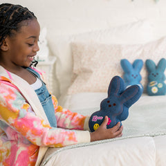 Animal Adventure Shaggy Bunny Peeps plush in collectible display setup.