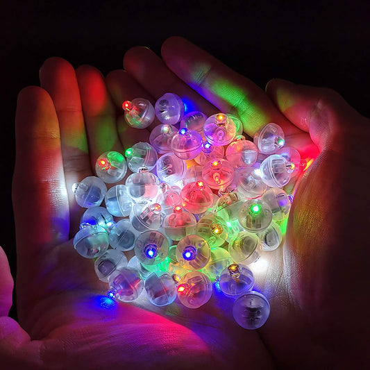 Aogist mini ball lights illuminate paper lanterns with vibrant color.