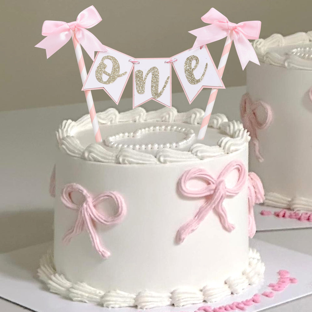 AOQURE pink bow ribbon cake topper crowns a celebration cake, ideal for photos.