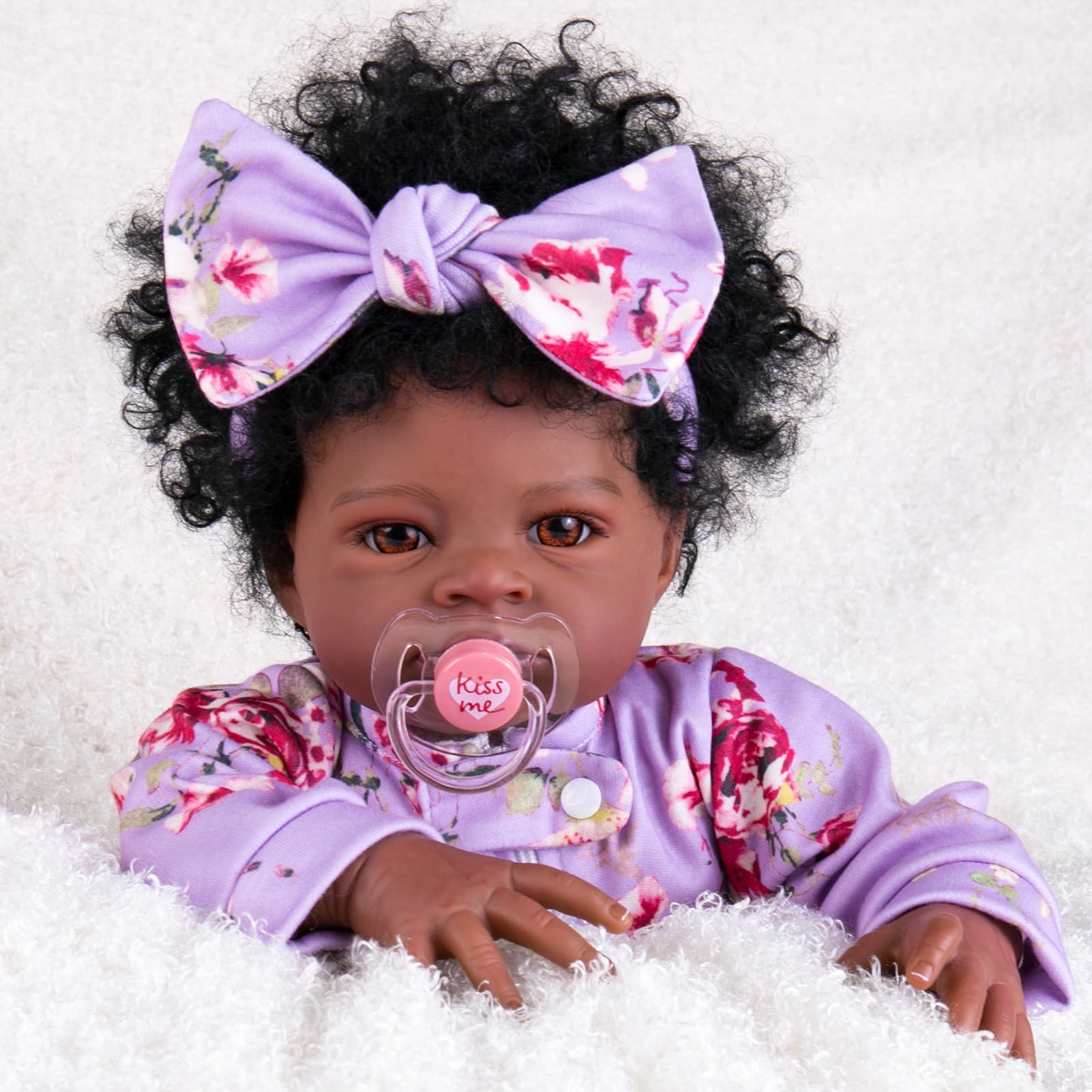 Aori Black Reborn Baby Doll Girl 20 inch with lifelike face for display and imaginative play.