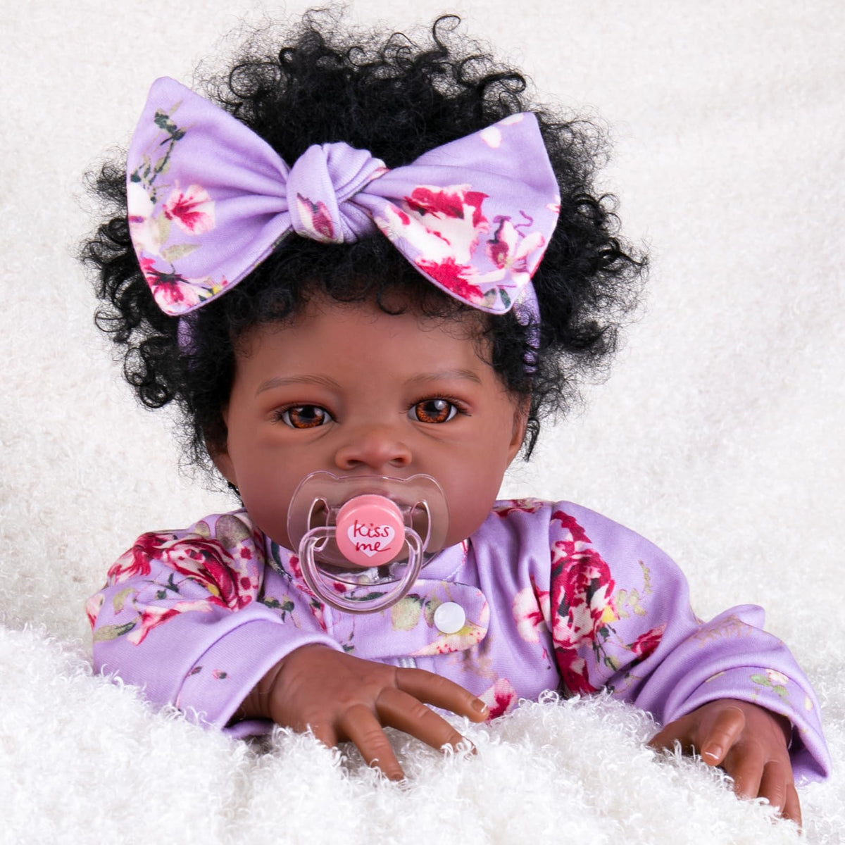Aori Black Reborn Baby Doll Girl 20 inch with lifelike face for display and imaginative play.