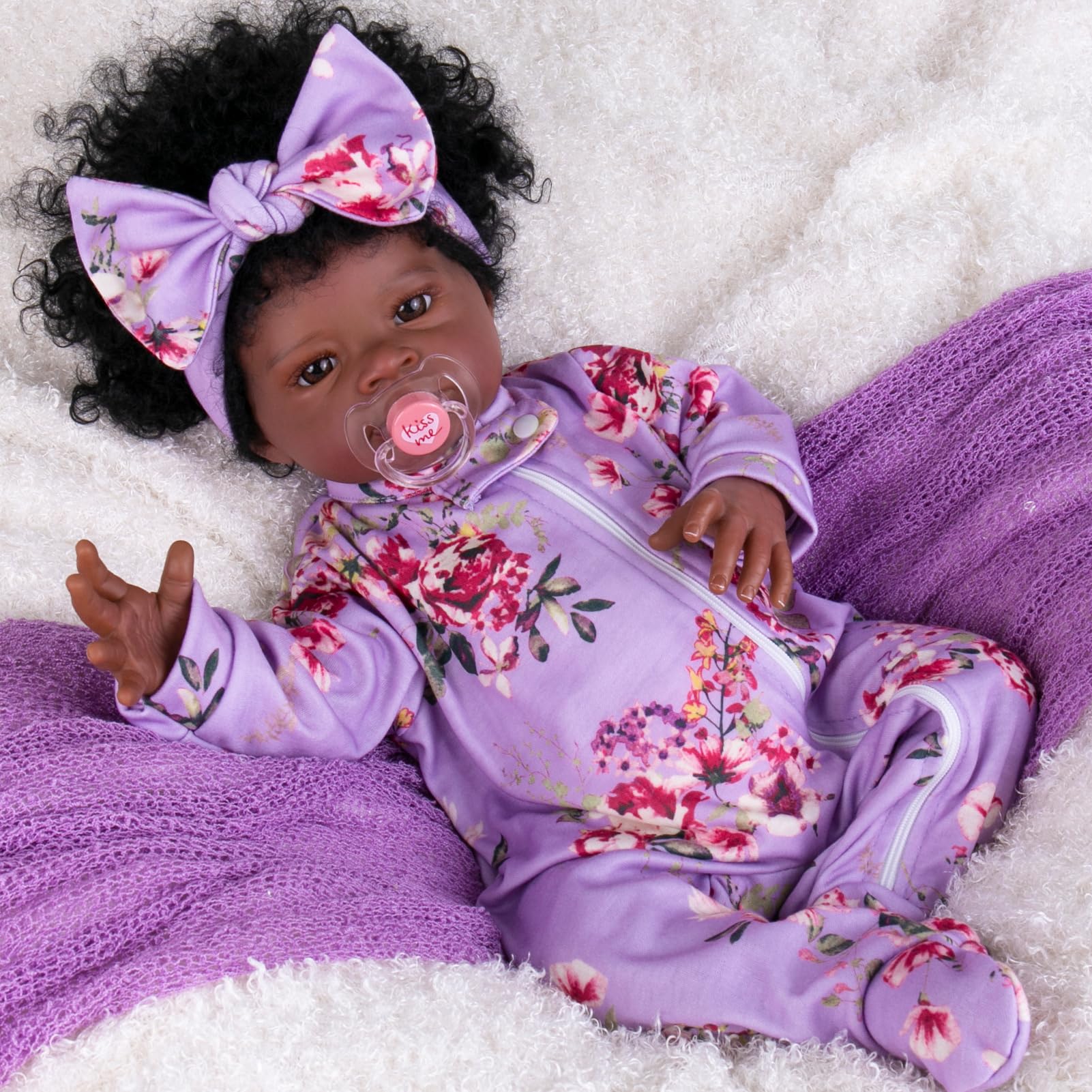 Aori Black Reborn Doll shows soft vinyl hands and feet for a realistic touch.