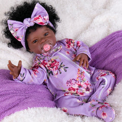 Aori Black Reborn Doll shows soft vinyl hands and feet for a realistic touch.