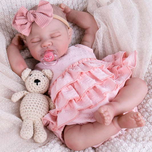 Aori pink dress set with socks and headband on reborn doll, versatile wardrobe option.